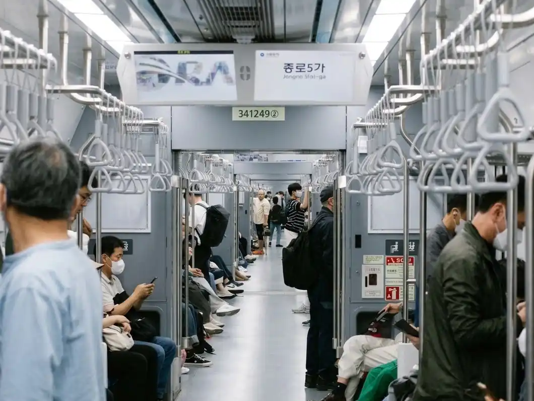 Commuters inside a Seoul subway car